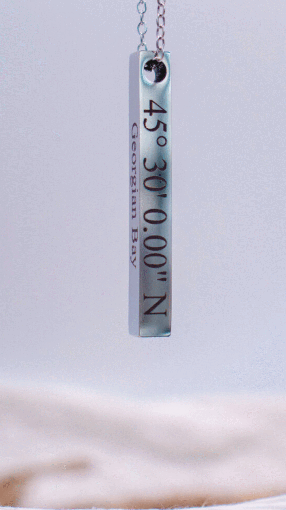 Silver pendant necklace engraved with '45° 30' 0.00" N Georgian Bay.