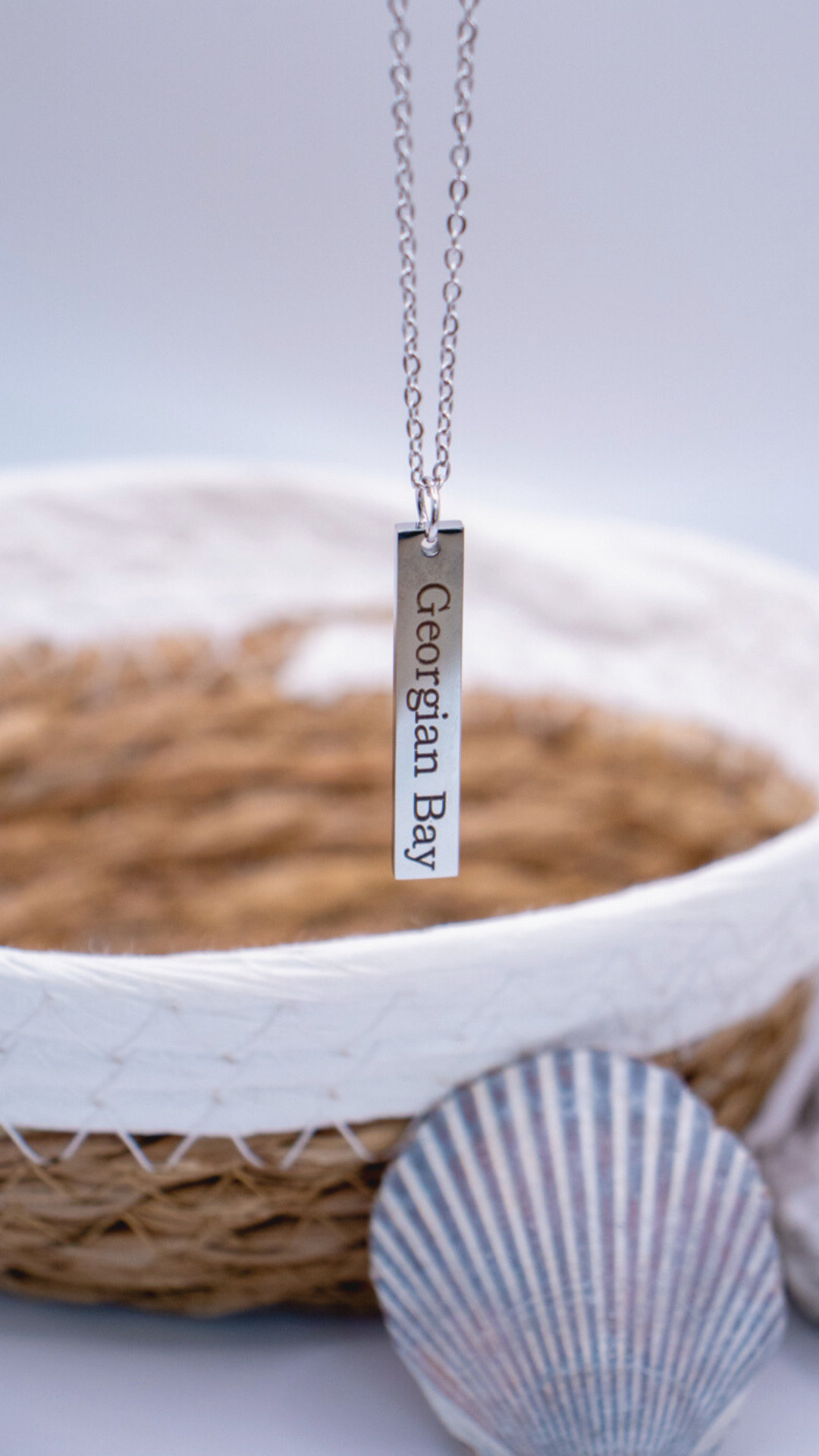 Silver necklace with a rectangular pendant engraved with 'Georgian Bay.'